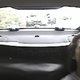 Sarah Webb seen crying in the back of a police cruiser after being arrested on the whim of a coin flip.
